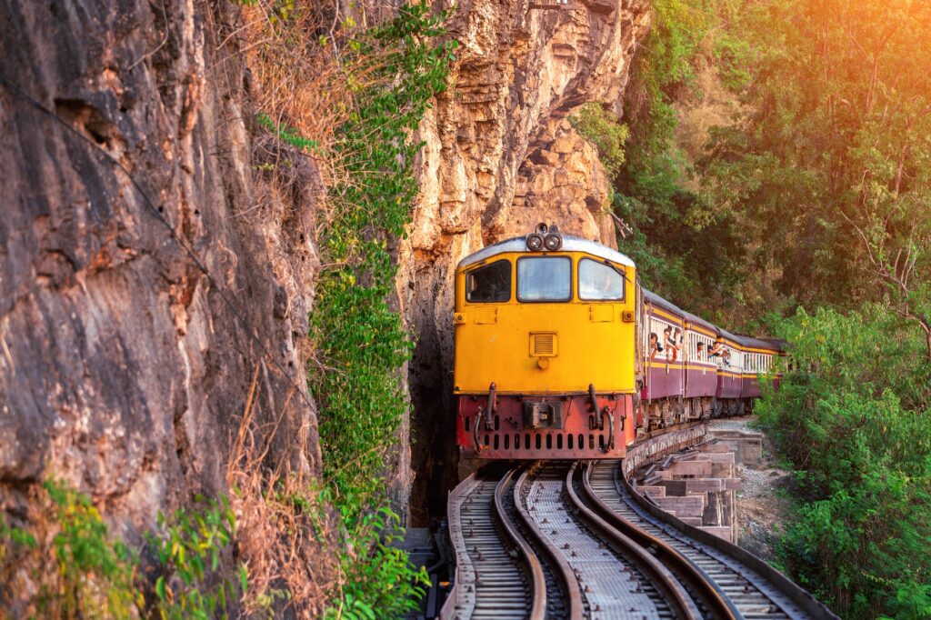 Best Train Journeys for a Relaxed and Scenic Experience 3 Thai retro train in Kanchanaburi, Thailand.